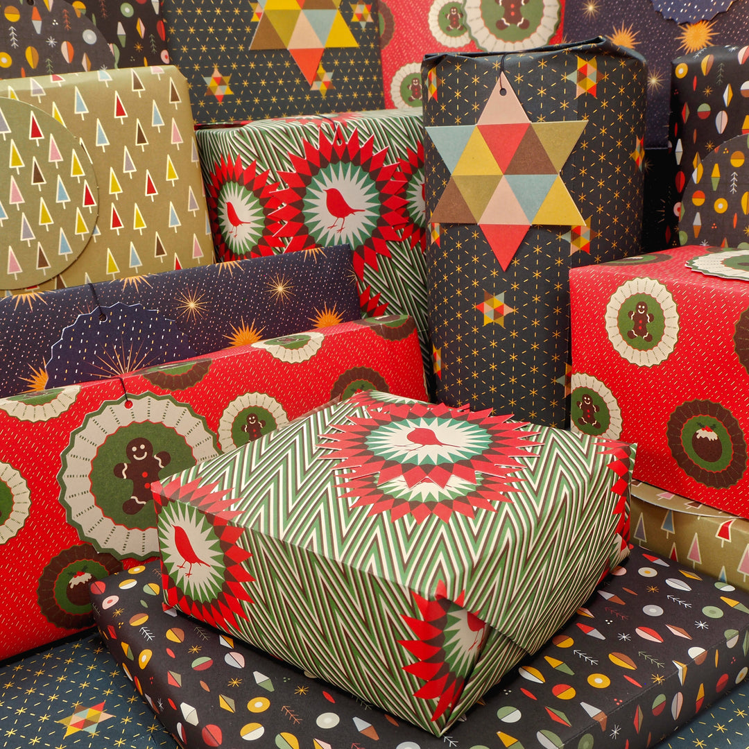Presents wrapped with Bright Stem Recyclable Christmas Wrapping Paper Gift Wrap Folded (6) Sheets and Tags Mixed Pack .