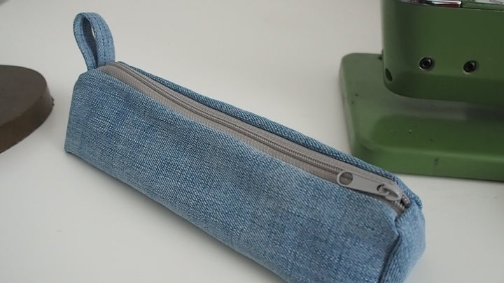 Small Pencil Case made with Upcycled Light Denim and Organic Cotton with Orange Star Pattern for the Inner Lining.