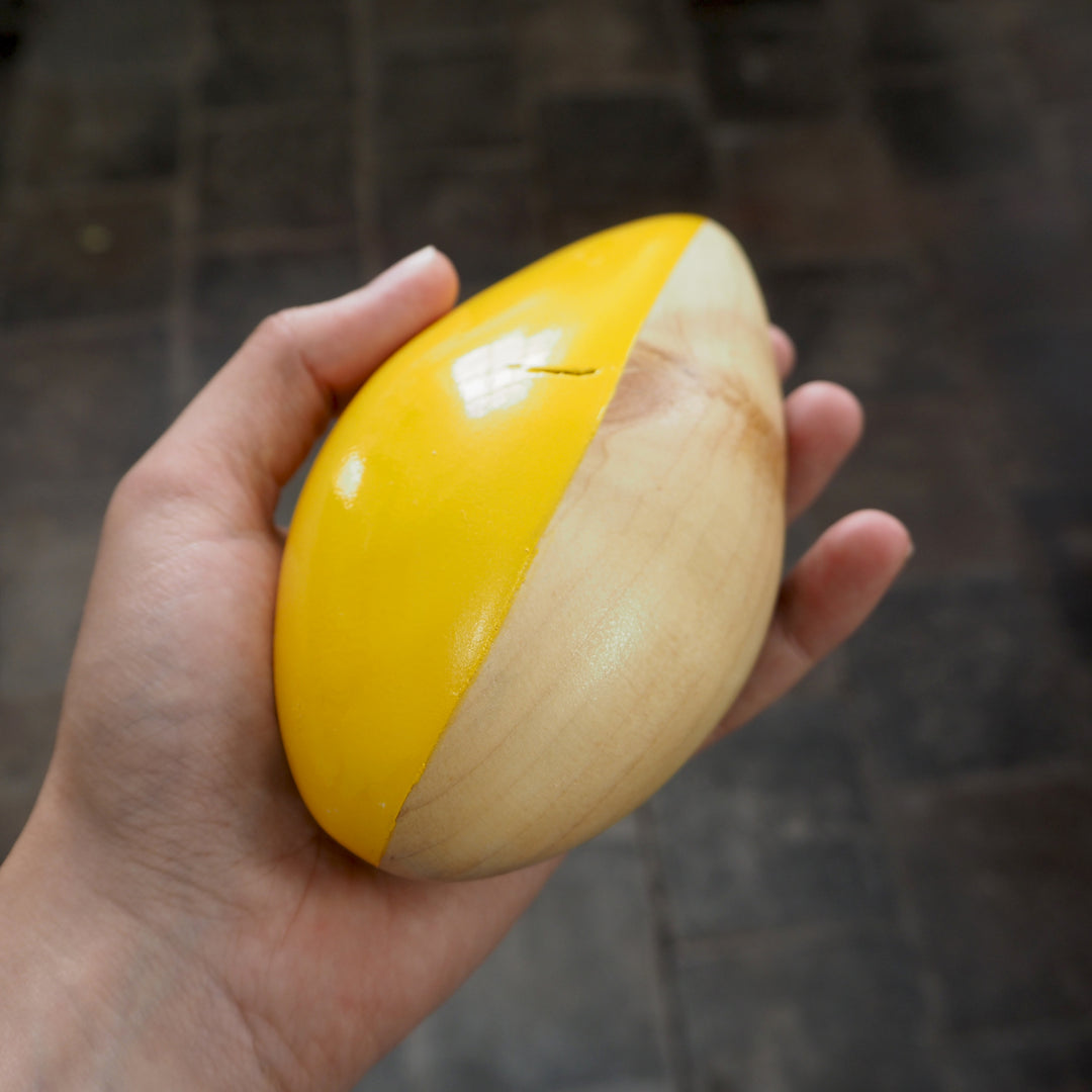 Contemporary Abstract Sculpture S8.2 Pinewood with Yellow Paint Limited Edition 1/1 held in artists hand- bright stem