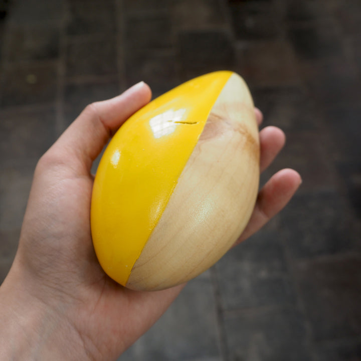 Contemporary Abstract Sculpture S8.2 Pinewood with Yellow Paint Limited Edition 1/1 held in artists hand- bright stem