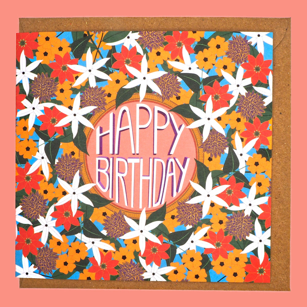 Colourful floral birthday card with 'Happy Birthday' text on a pink background