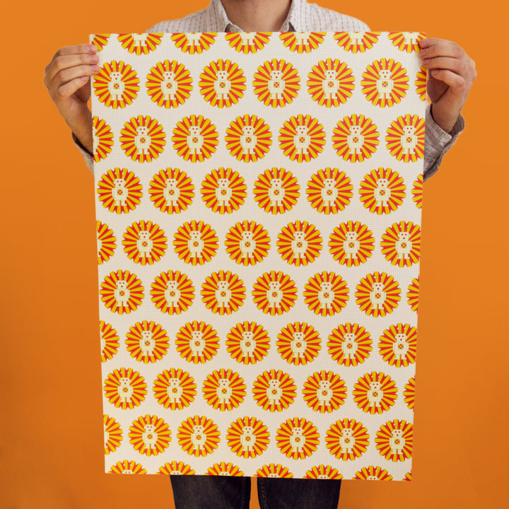 Bright Stem Kids wrapping paper. Sci-fi robot pattern. Held by artist and designer. Recyclable and made in the UK.