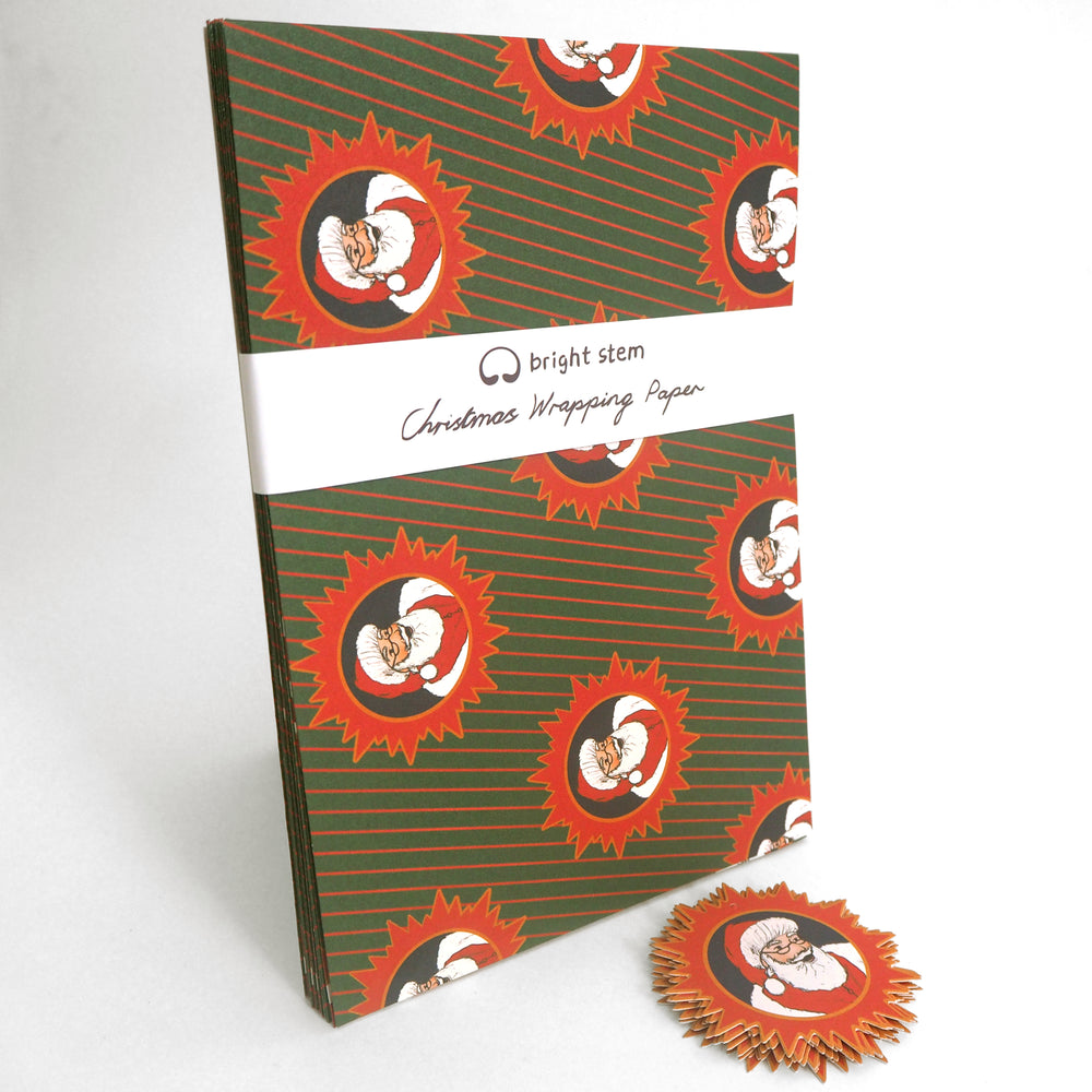 Pack of Bright Stem Recyclable Christmas wrapping paper with Santa Claus design on a white background.