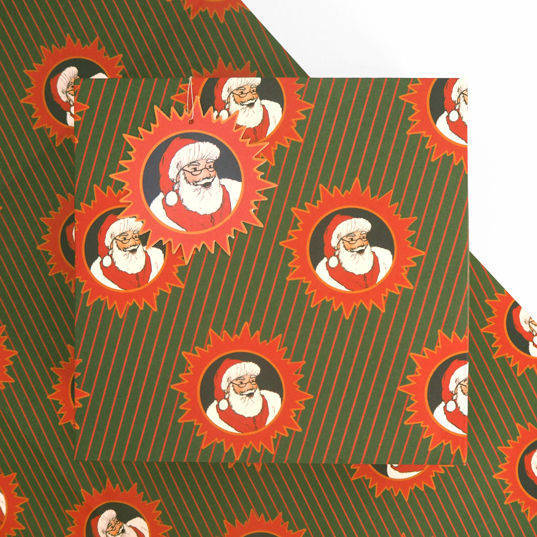 Christmas wrapping paper with a repeated Illustration of  Santa Claus on a green and red stripped background.