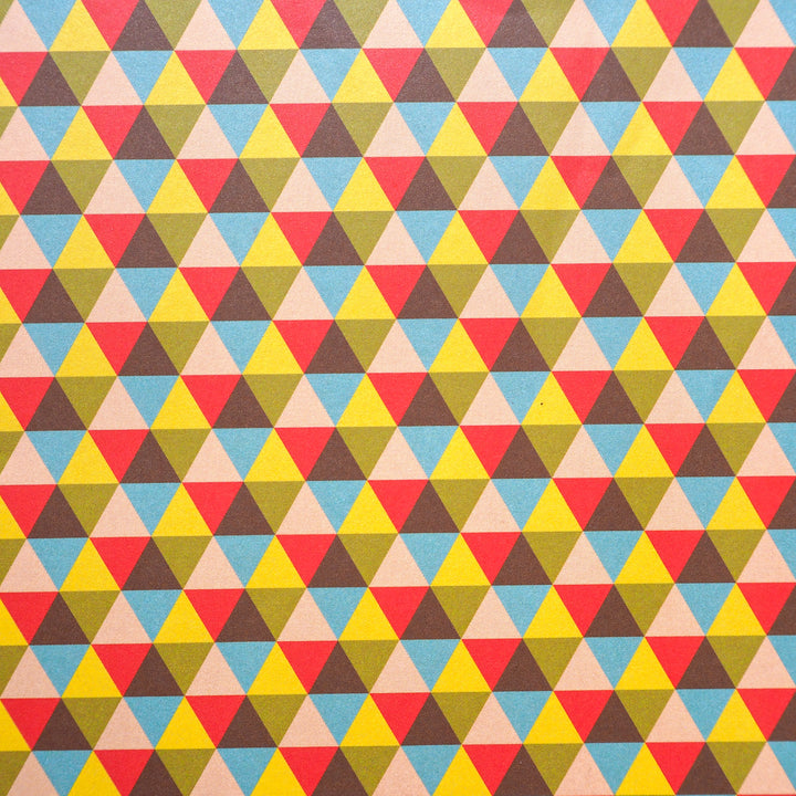 Bright Stem colourful geometric triangle pattern on gift wrap. close up 