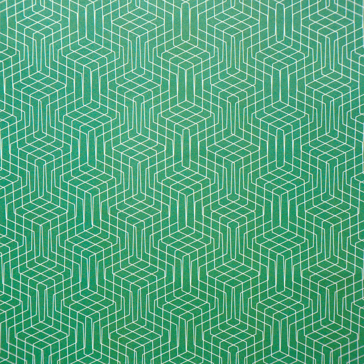 Bright Stem recyclable wrapping paper. Geometric pattern with white lines on an emerald green background. Close up