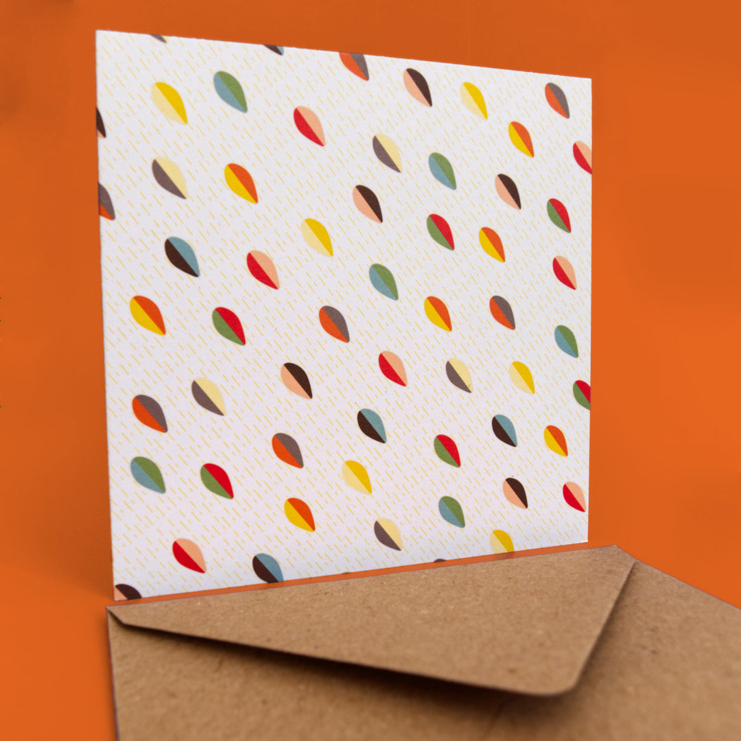 bright stem Greeting card with colourful abstract multicoloured pattern and brown envelope on a orange background. blank on the inside. Made in the UK from recycled card