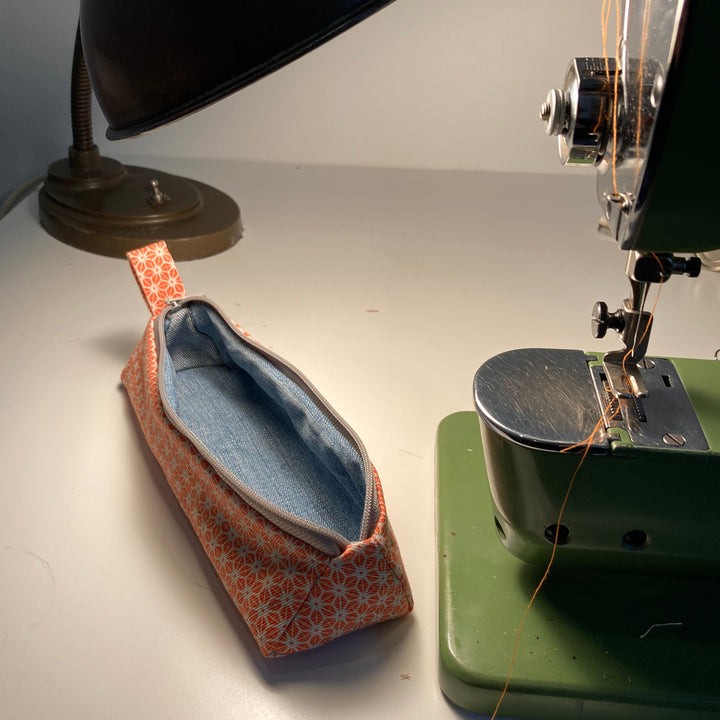 bright stem pencil case handmade with orange star pattern printed organic cotton and upcycled denim lining