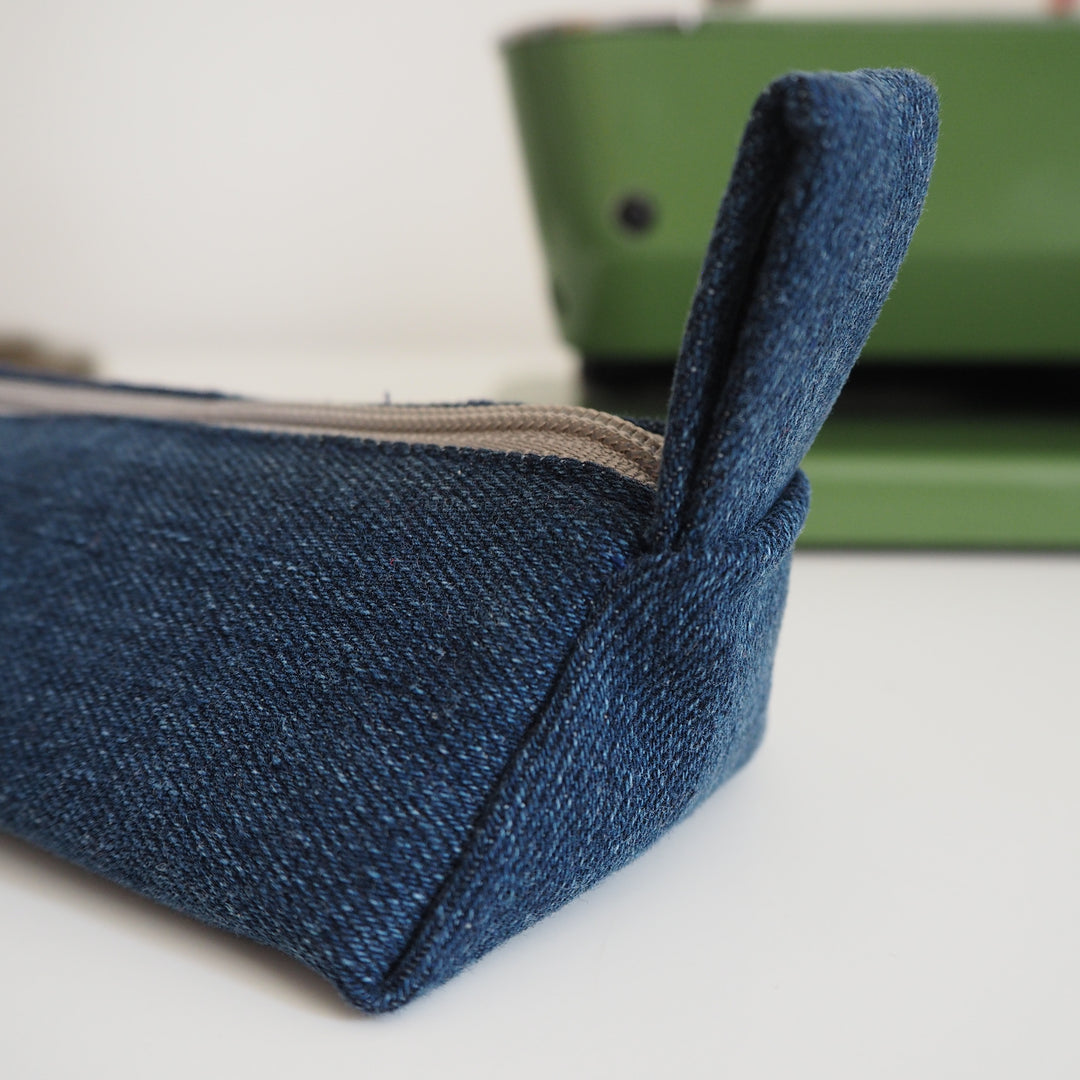 Bright Stem Small Pencil Case made with Upcycled Denim and Organic Cotton with Orange Star Pattern for the Inner Lining.