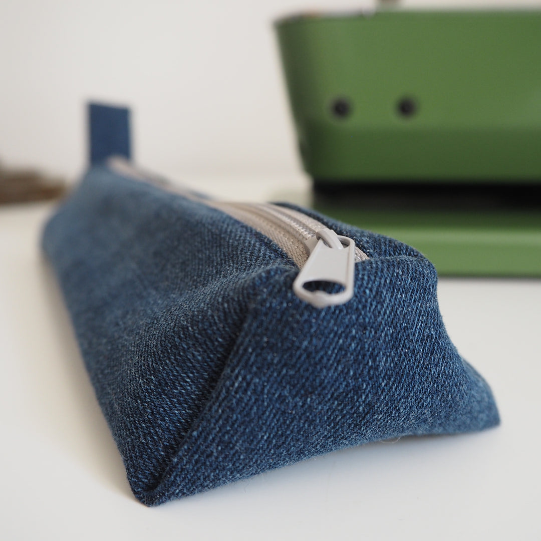 Bright Stem Small Pencil Case made with Upcycled Denim and Organic Cotton with Orange Star Pattern for the Inner Lining.