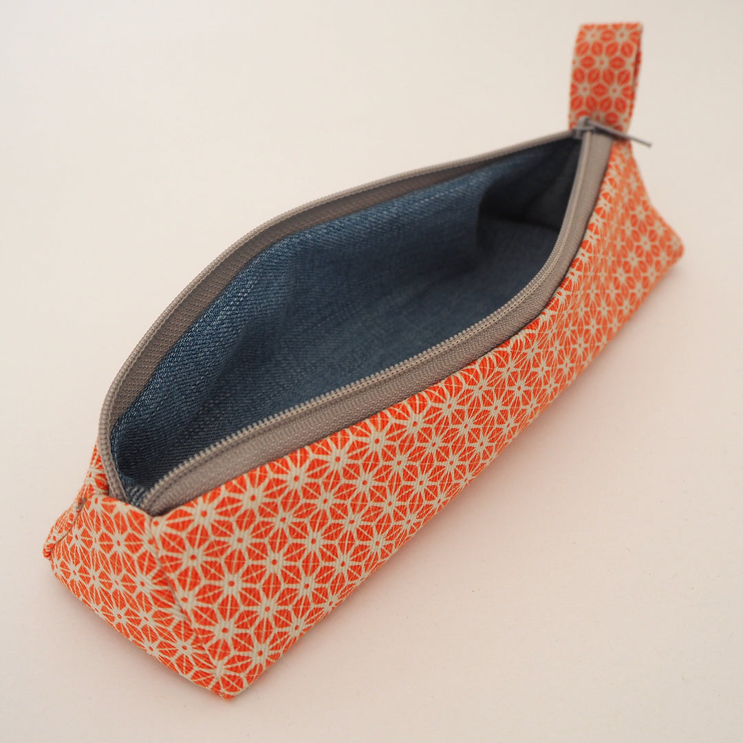 bright stem pencil case handmade with orange star pattern printed organic cotton and upcycled denim lining