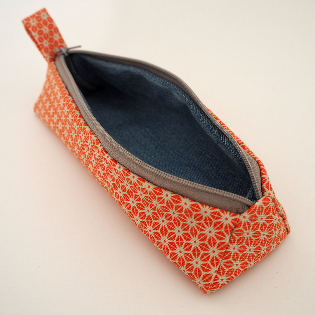 bright stem pencil case handmade with orange star pattern printed organic cotton and upcycled denim lining