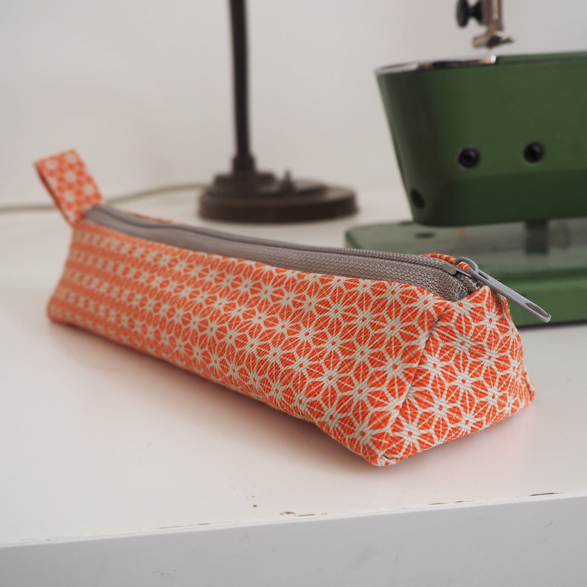 bright stem pencil case handmade with orange star pattern printed organic cotton and upcycled denim lining