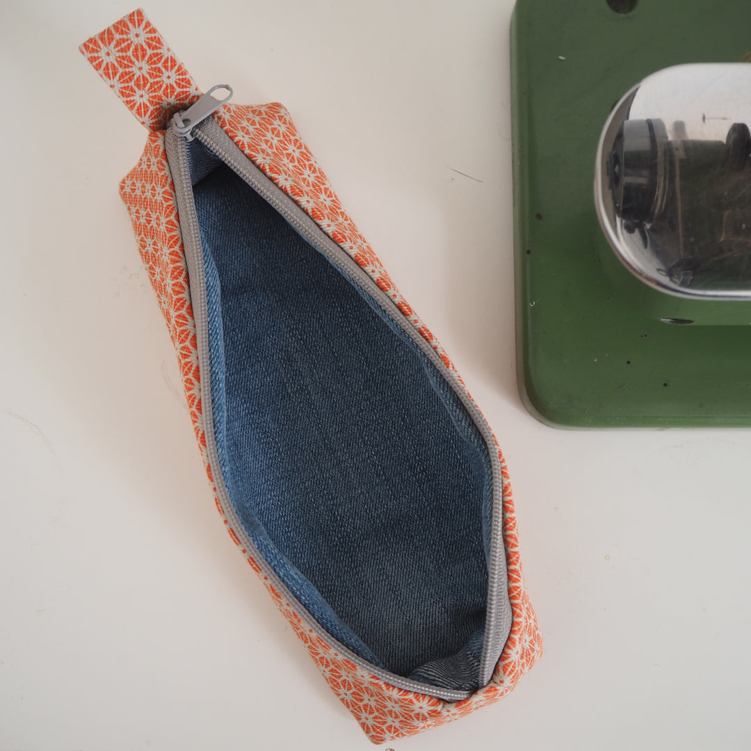 bright stem pencil case handmade with orange star pattern printed organic cotton and upcycled denim lining