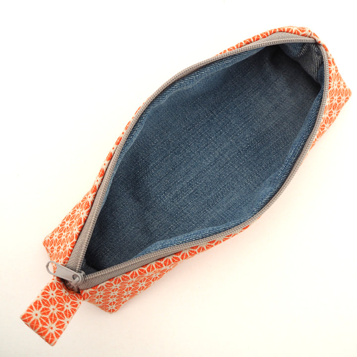 bright stem pencil case handmade with orange star pattern printed organic cotton and upcycled denim lining