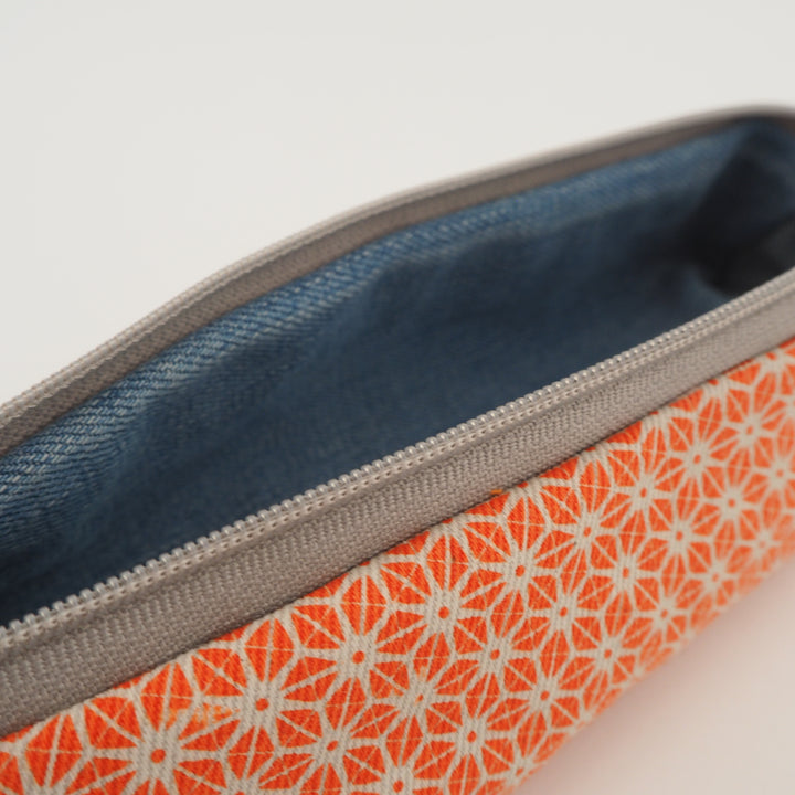 bright stem pencil case handmade with orange star pattern printed organic cotton and upcycled denim lining