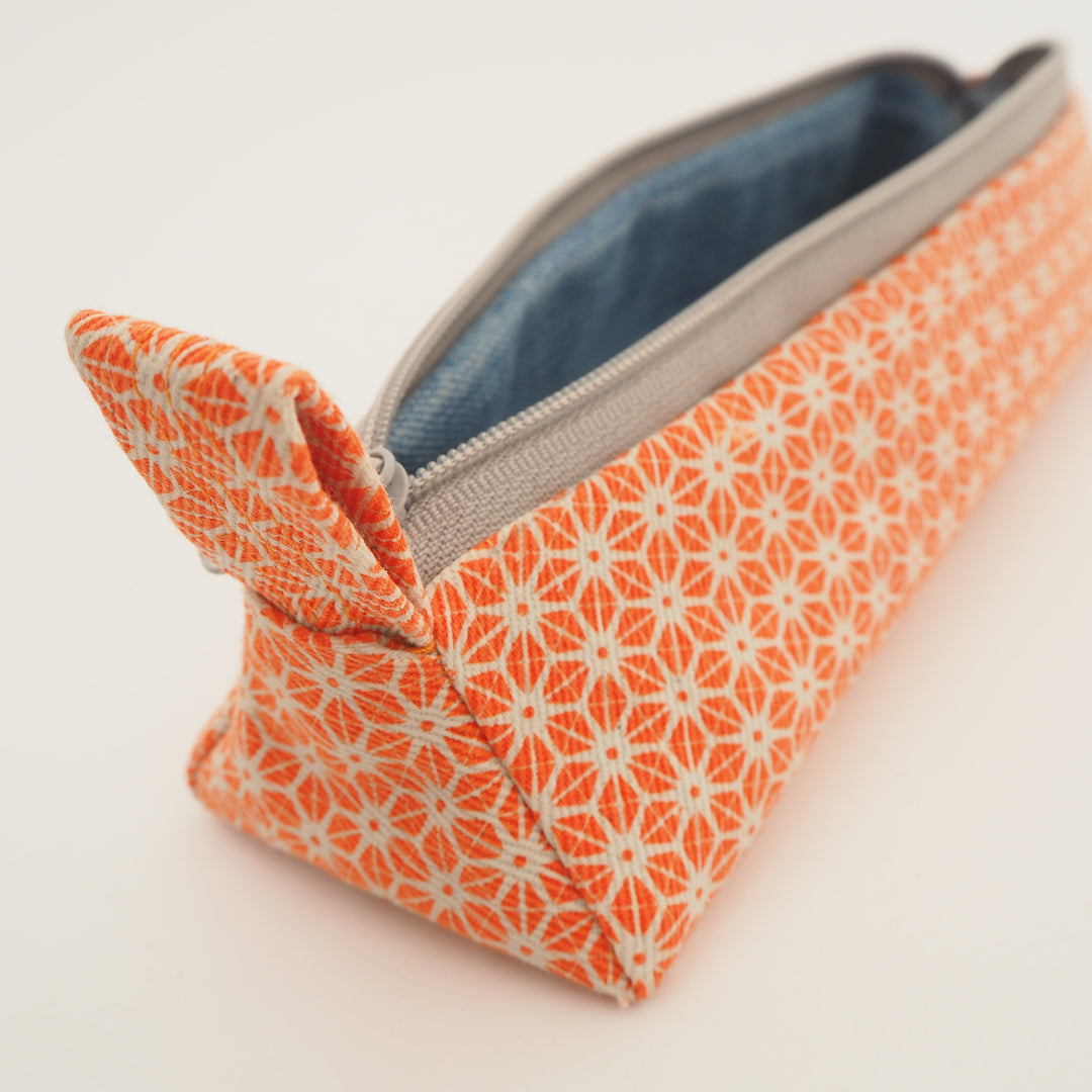 bright stem pencil case handmade with orange star pattern printed organic cotton and upcycled denim lining