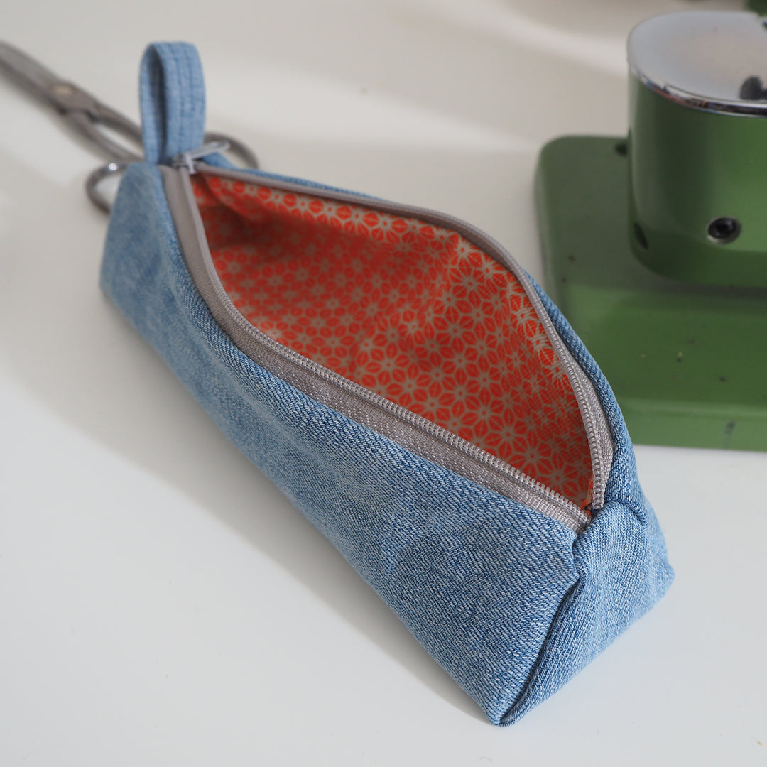 Bright Stem Small Pencil Case made with Upcycled Denim and Organic Cotton with Orange Star Pattern for the Inner Lining.