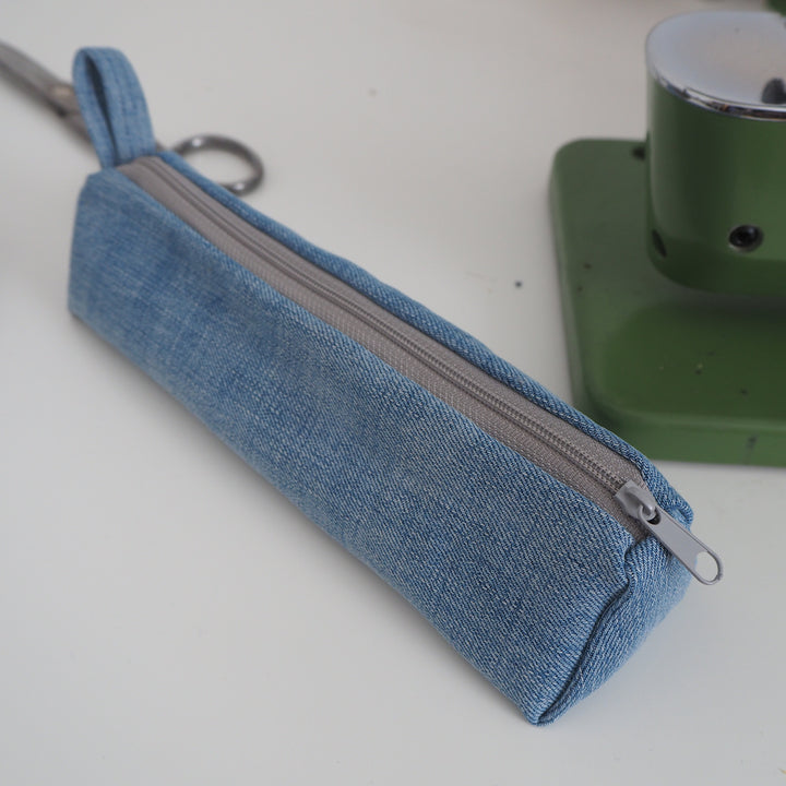 Bright Stem Small Pencil Case made with Upcycled Denim and Organic Cotton with Orange Star Pattern for the Inner Lining.