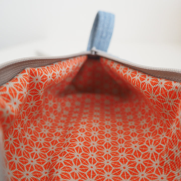 Bright Stem Small Pencil Case made with Upcycled Denim and Organic Cotton with Orange Star Pattern for the Inner Lining.