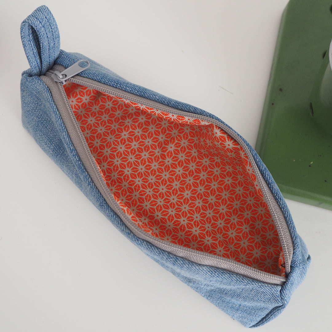 Bright Stem Small Pencil Case made with Upcycled Denim and Organic Cotton with Orange Star Pattern for the Inner Lining.