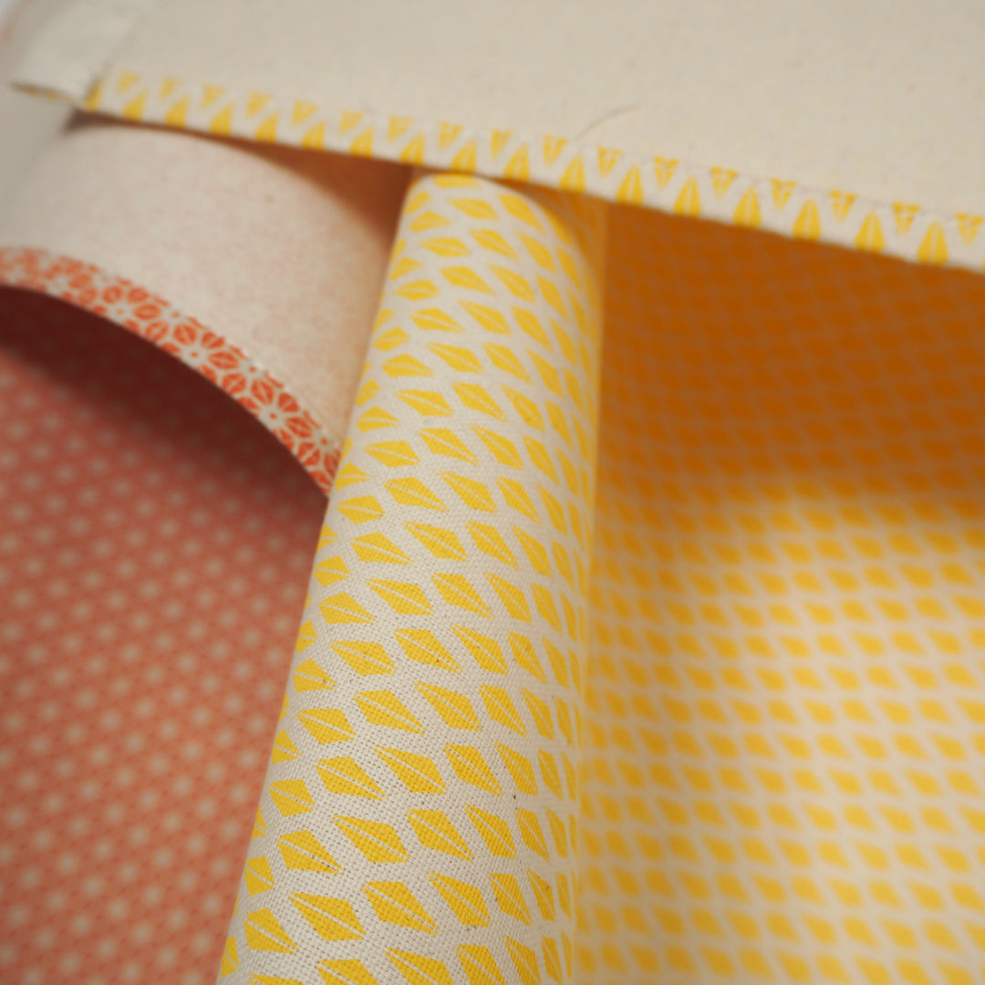 bright stem Set of Two Tea Towels Organic Cotton Orange Star and Yellow Triangle Patterns -close up detail reverse. GOTS certified. made in the UK. Surface pattern design.