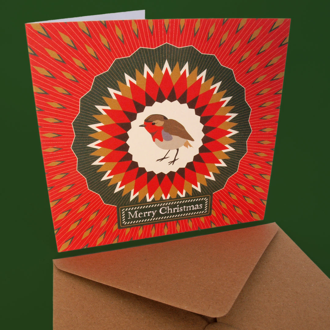 Christmas card with a robin illustration and 'Merry Christmas' text on vintage style pattern design.