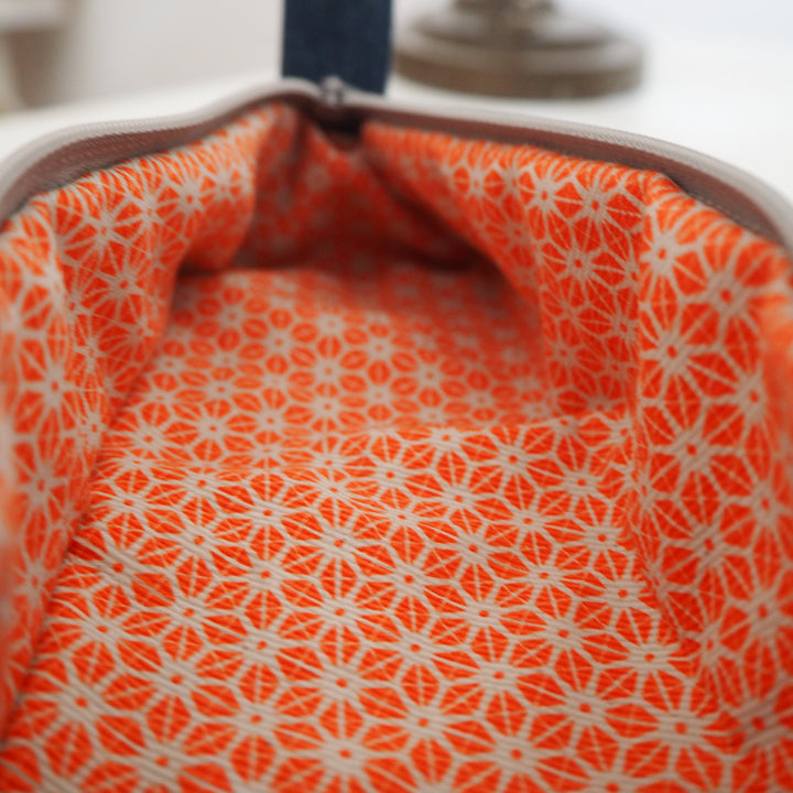 Bright Stem Small Pencil Case made with Upcycled Denim and Organic Cotton with Orange Star Pattern for the Inner Lining.