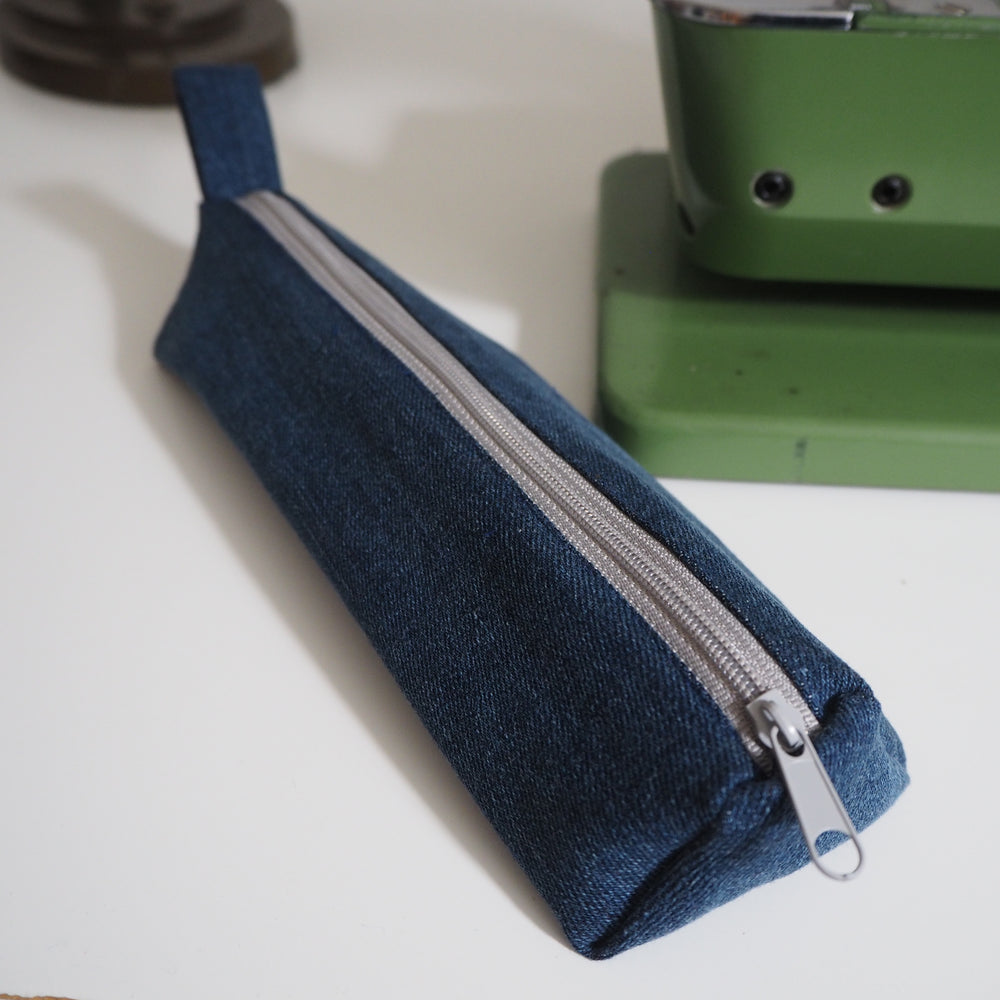 Bright Stem Small Pencil Case made with Upcycled Denim and Organic Cotton with Orange Star Pattern for the Inner Lining.