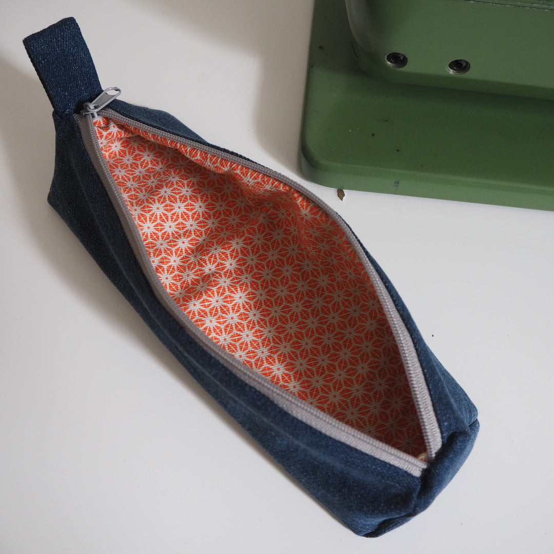 Bright Stem Small Pencil Case made with Upcycled Denim and Organic Cotton with Orange Star Pattern for the Inner Lining.
