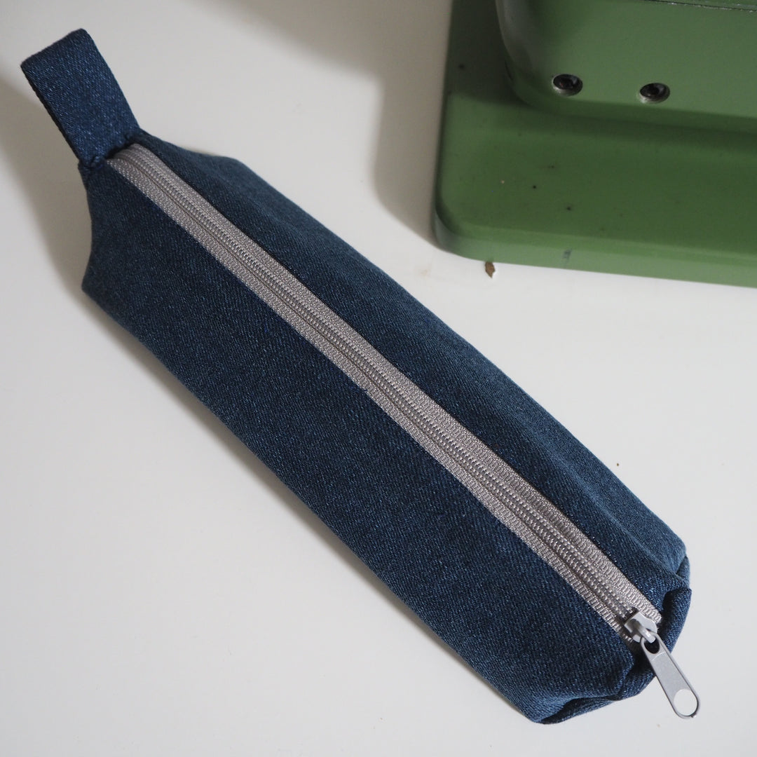 Bright Stem Small Pencil Case made with Upcycled Denim and Organic Cotton with Orange Star Pattern for the Inner Lining.