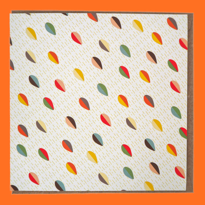 bright stem Greeting card with colourful abstract multicoloured pattern and brown envelope on a orange background. blank on the inside. Made in the UK from recycled card