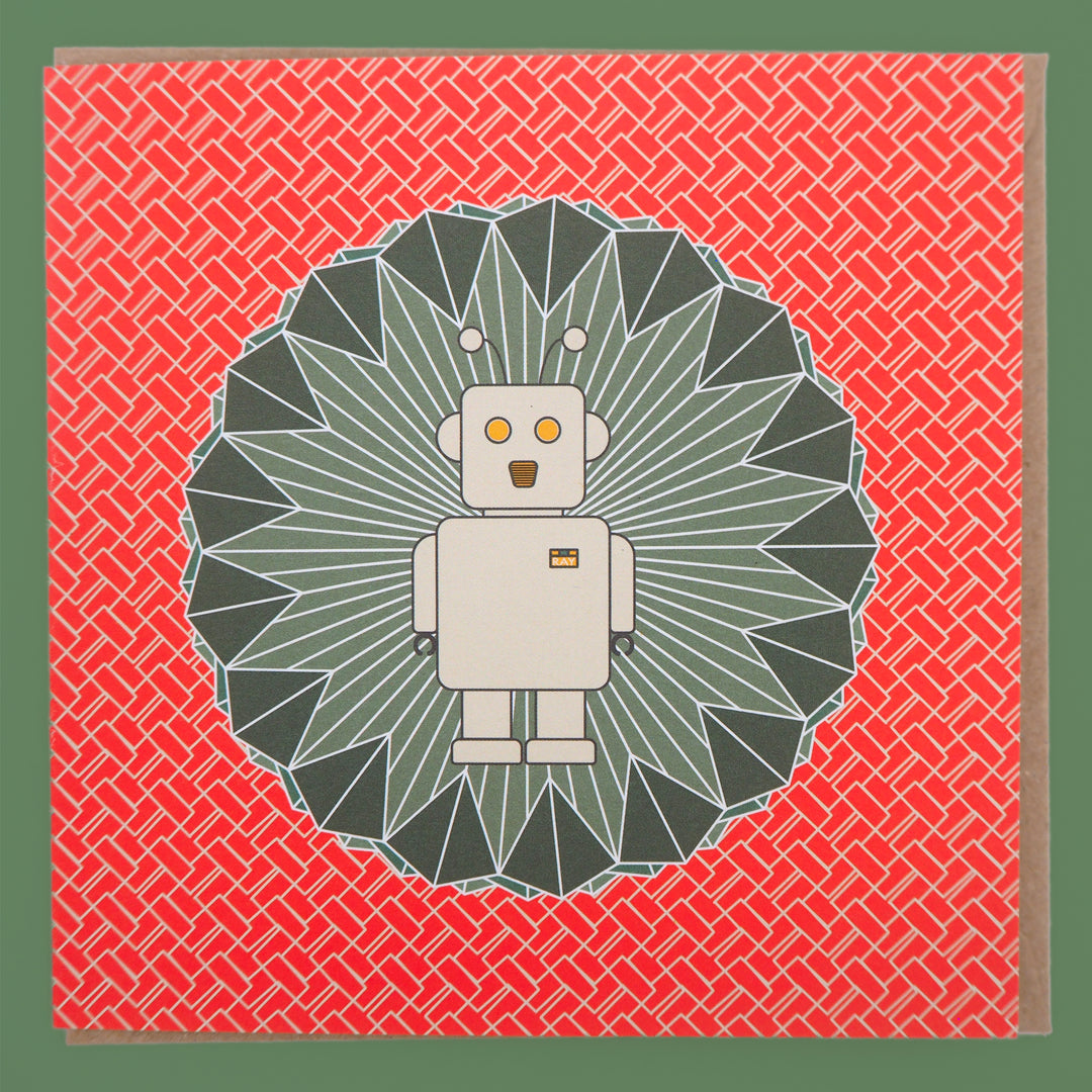 bright stem children's sc-fi birthday card. Ray the robot illustration on emerald green diamond shape with orangey red and white zigzag pattern. Stud up with brown craft envelope on a green background