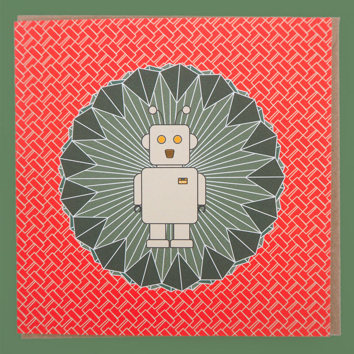 bright stem children's sc-fi birthday card. Ray the robot illustration on emerald green diamond shape with orangey red and white zigzag pattern. Stud up with brown craft envelope on a green background