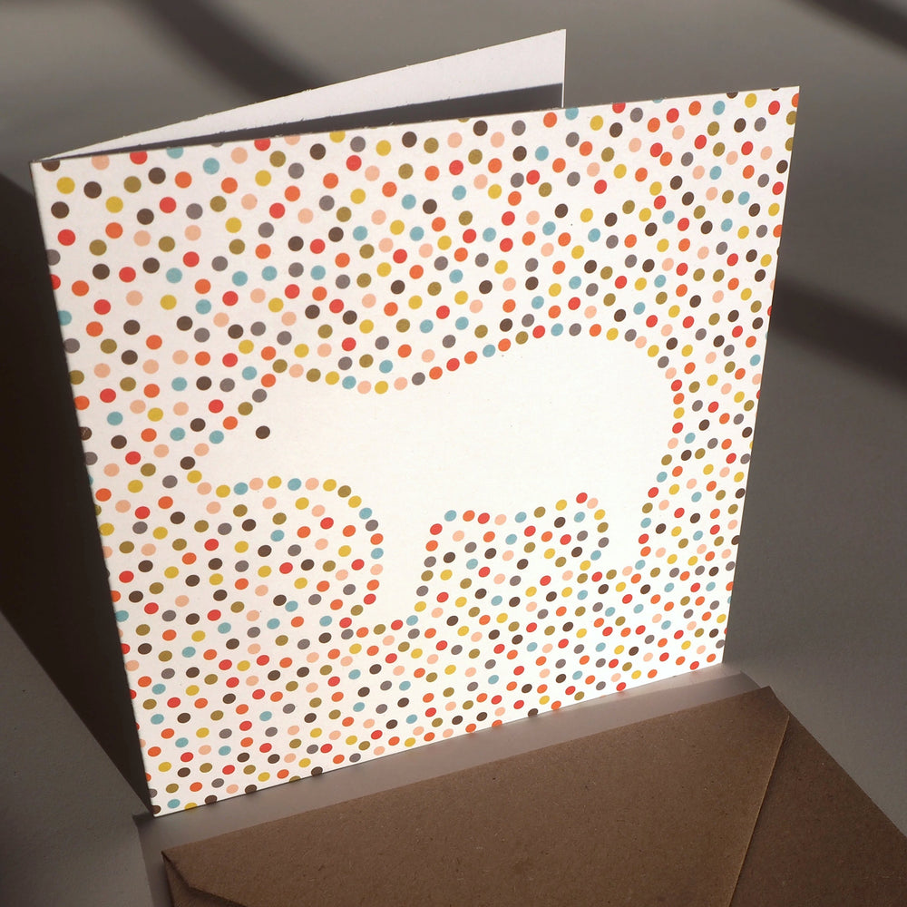 A Greeting card design featuring an illustration of a Polar Bear. Inspired by the way bright coloured circles are used in Pop Art paintings. I thought it might be interesting to draw the outline of shapes like a polar bear with coloured circles. this design was first created as an art print.&nbsp;