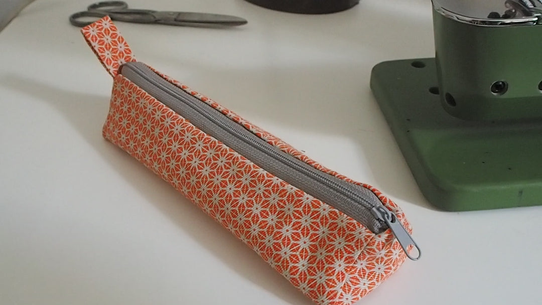 bright stem pencil case handmade with orange star pattern printed organic cotton and upcycled denim lining