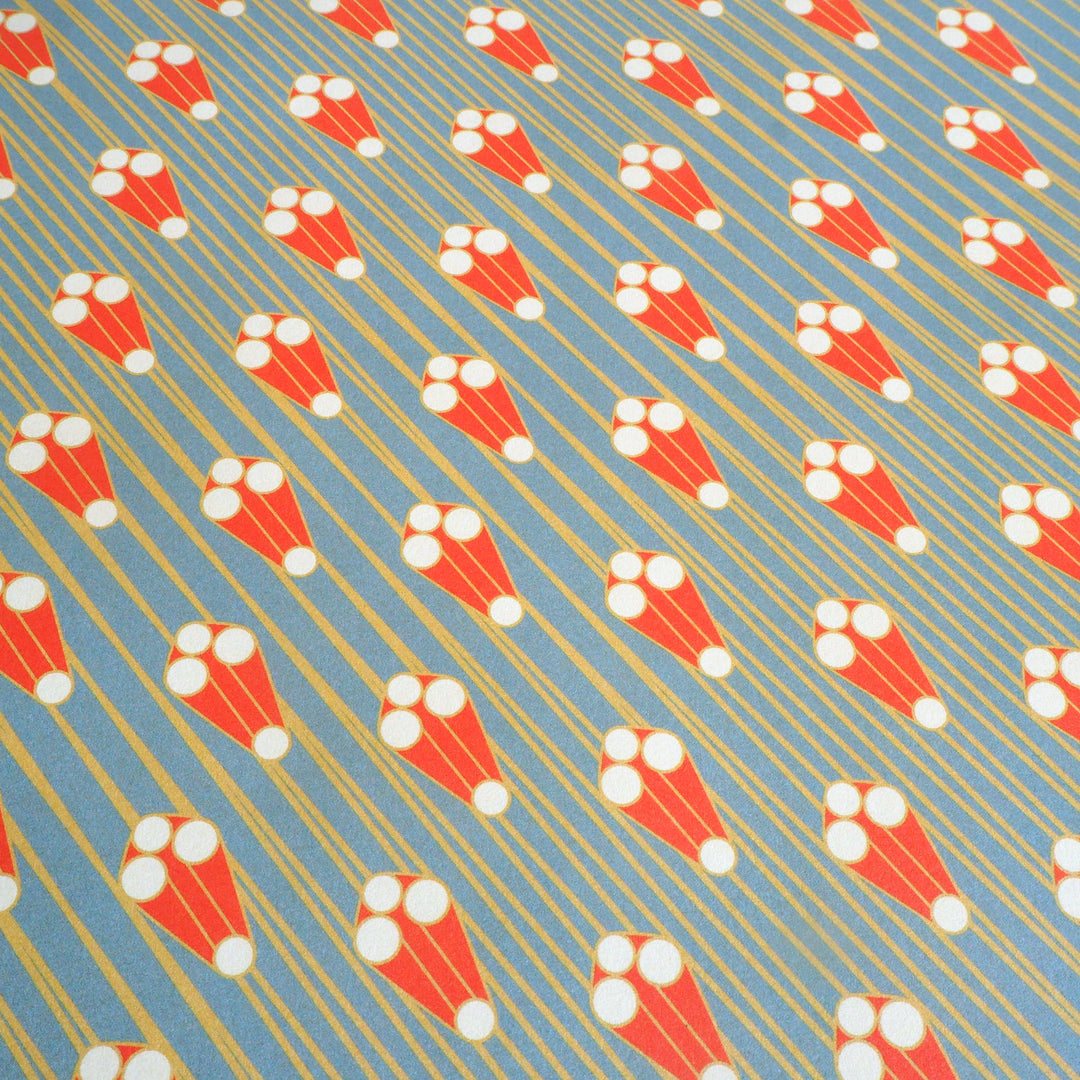 bright stem close up of sheet of Recyclable Gift Wrapping Paper Geometric Vintage Style Pattern unique early 20th century, art deco style design, multicoloured ethically manufactured, made in the uk,